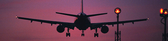 photo of jet landing at dusk