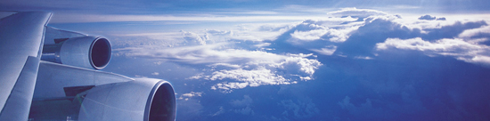 photo of jet wing and clouds